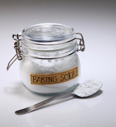 close-up-baking-soda-with-spoon-white-background_441362-12405