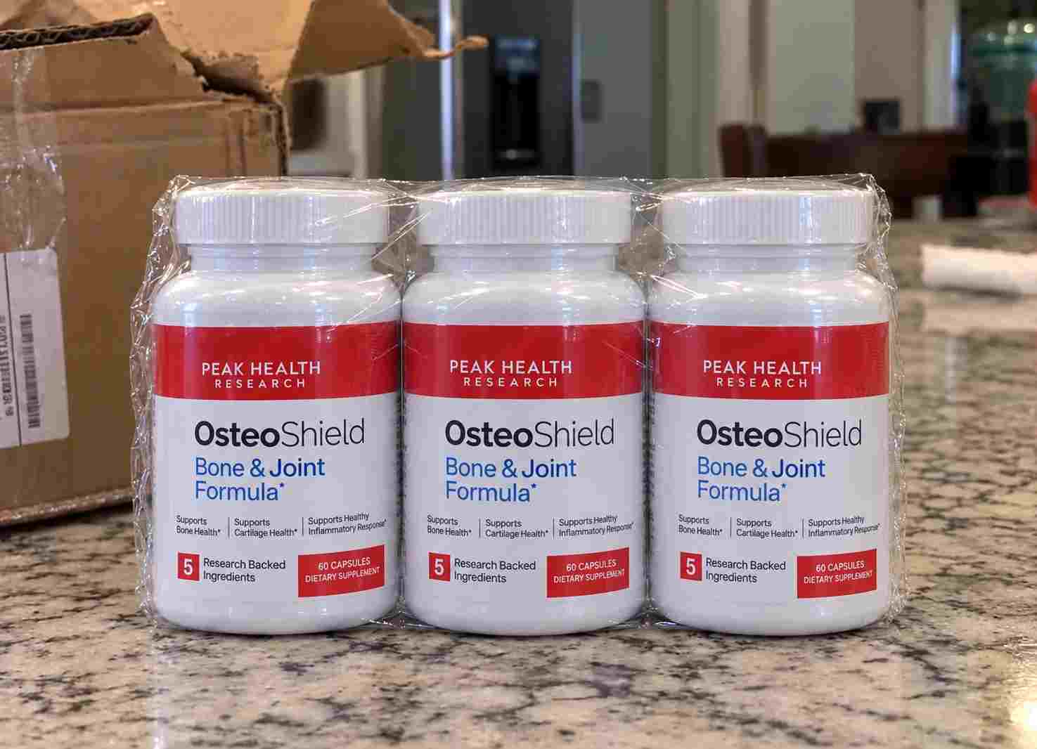 Three OsteoShield bottles on granite counter